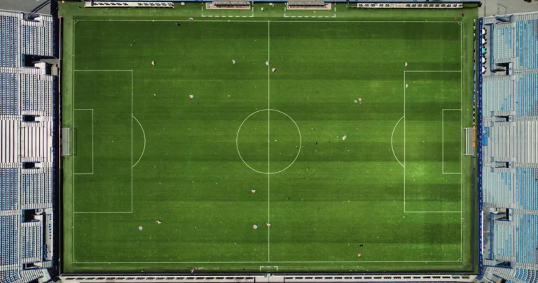 An aerial view of a football pitch with clearly marked playing areas
